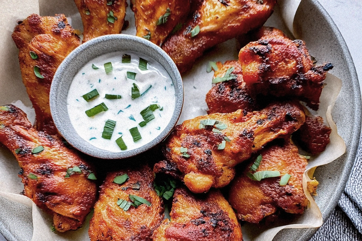 Crispy chicken wings served with dipping sauce