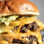 Perfectly crispy smash burger with American cheese and tangy pickles