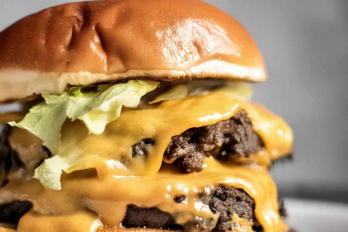 Perfectly crispy smash burger with American cheese and tangy pickles